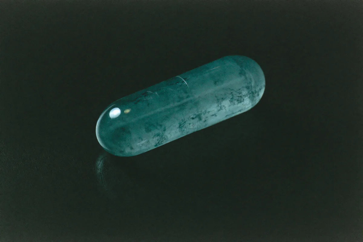 Symbolic 35mm film still life illustrating Sleep Efficiency in the AE·ORA supplement glossary